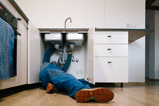 Professional Emergency Plumber technician working in Malone, WI